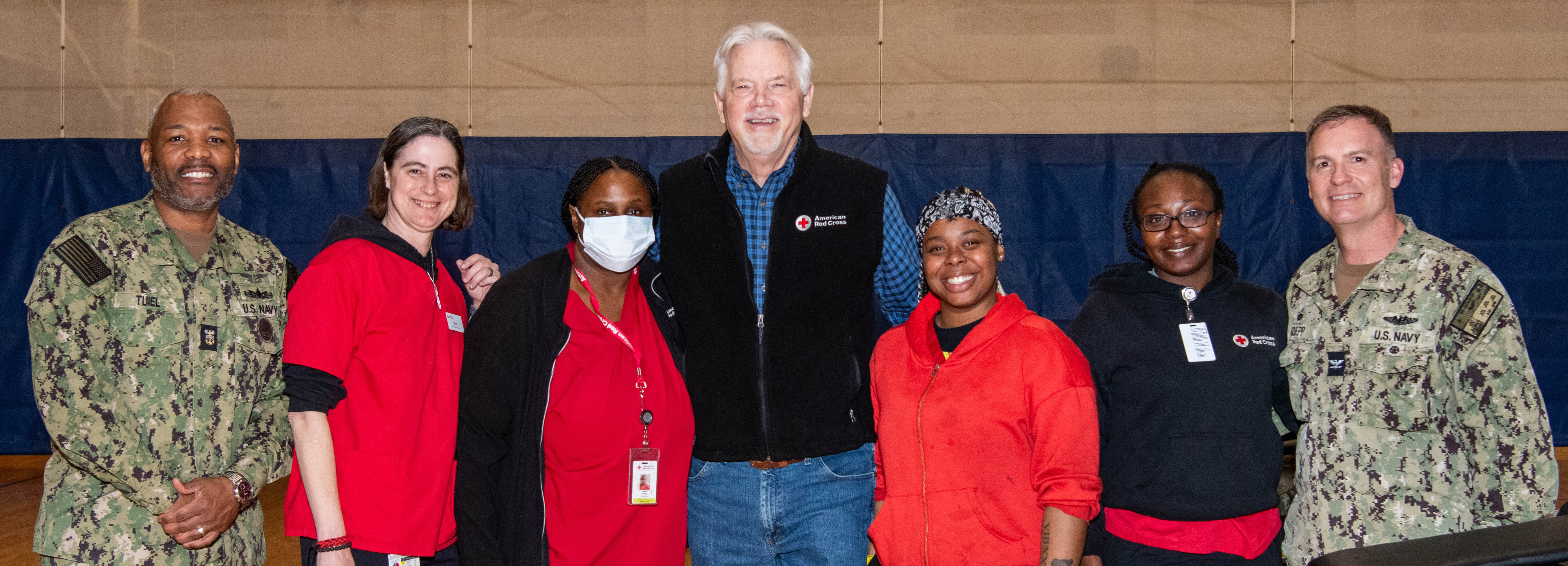 A photo of American Red Cross team members and base leadership standing together.